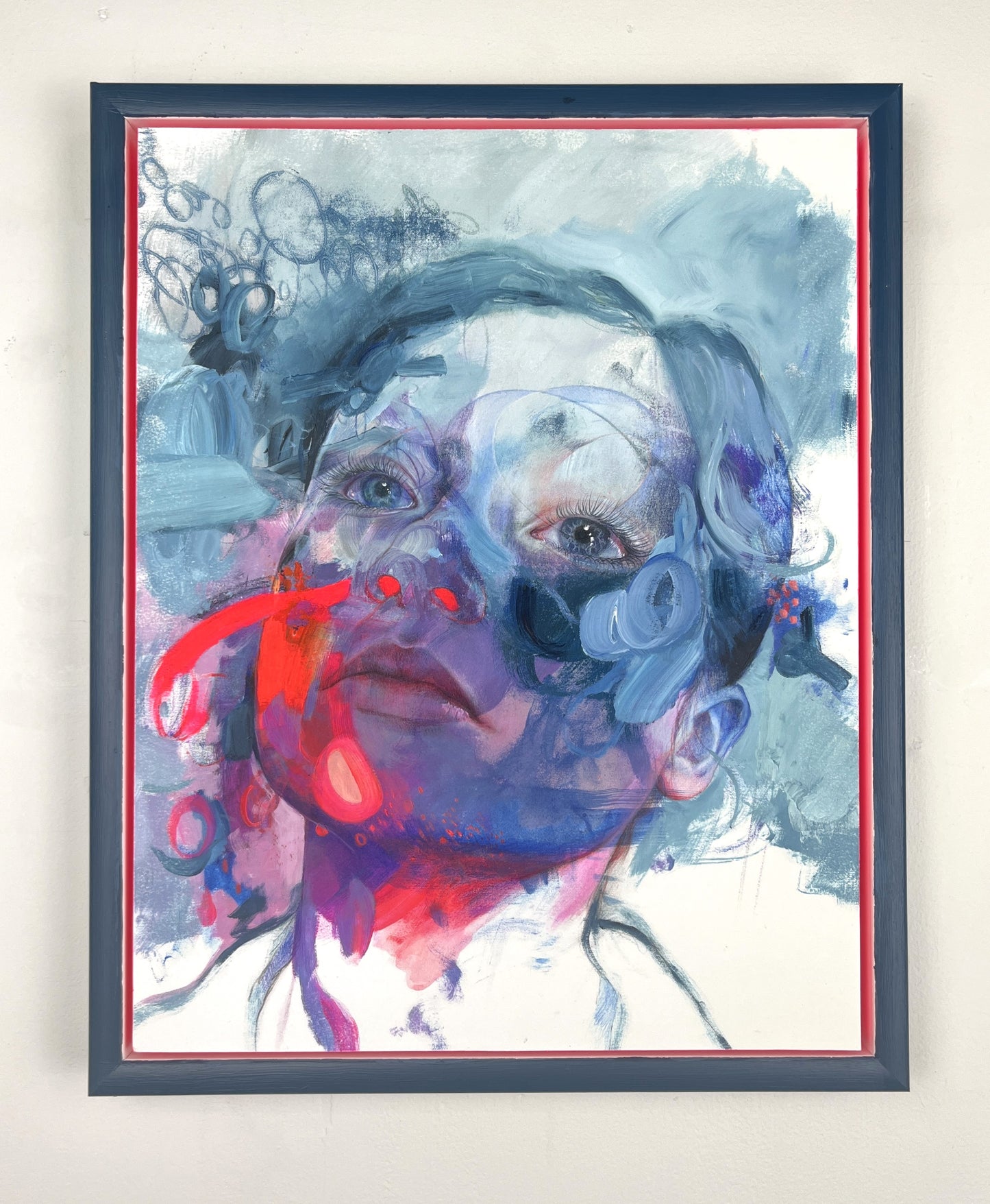 Framed image of artwork on a white wall