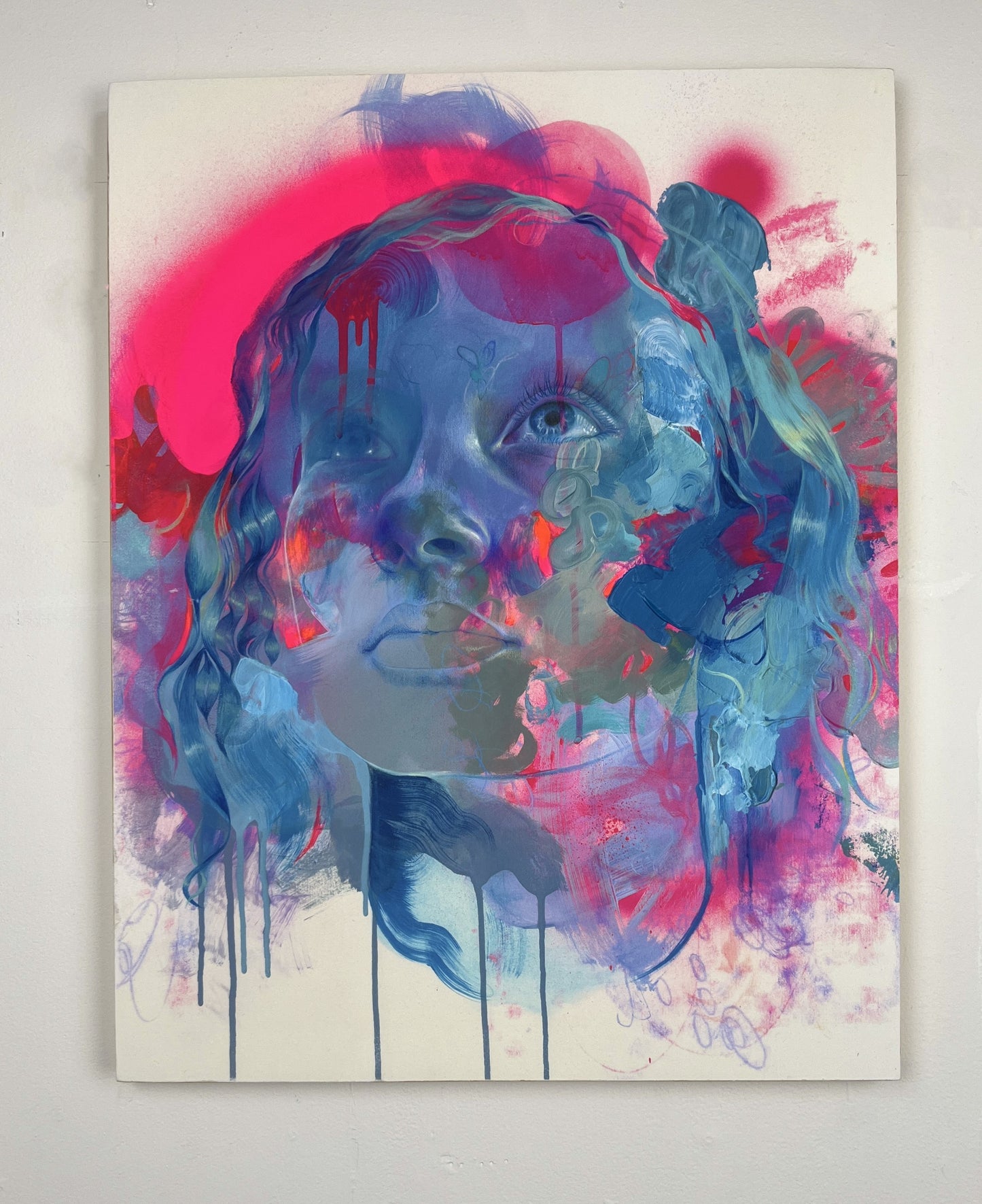 Unframed image of pink blue portrait hanging on a white wall background
