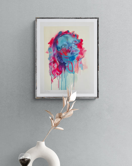 Framed pink blue artwork handing on grey wall with vase of flowers