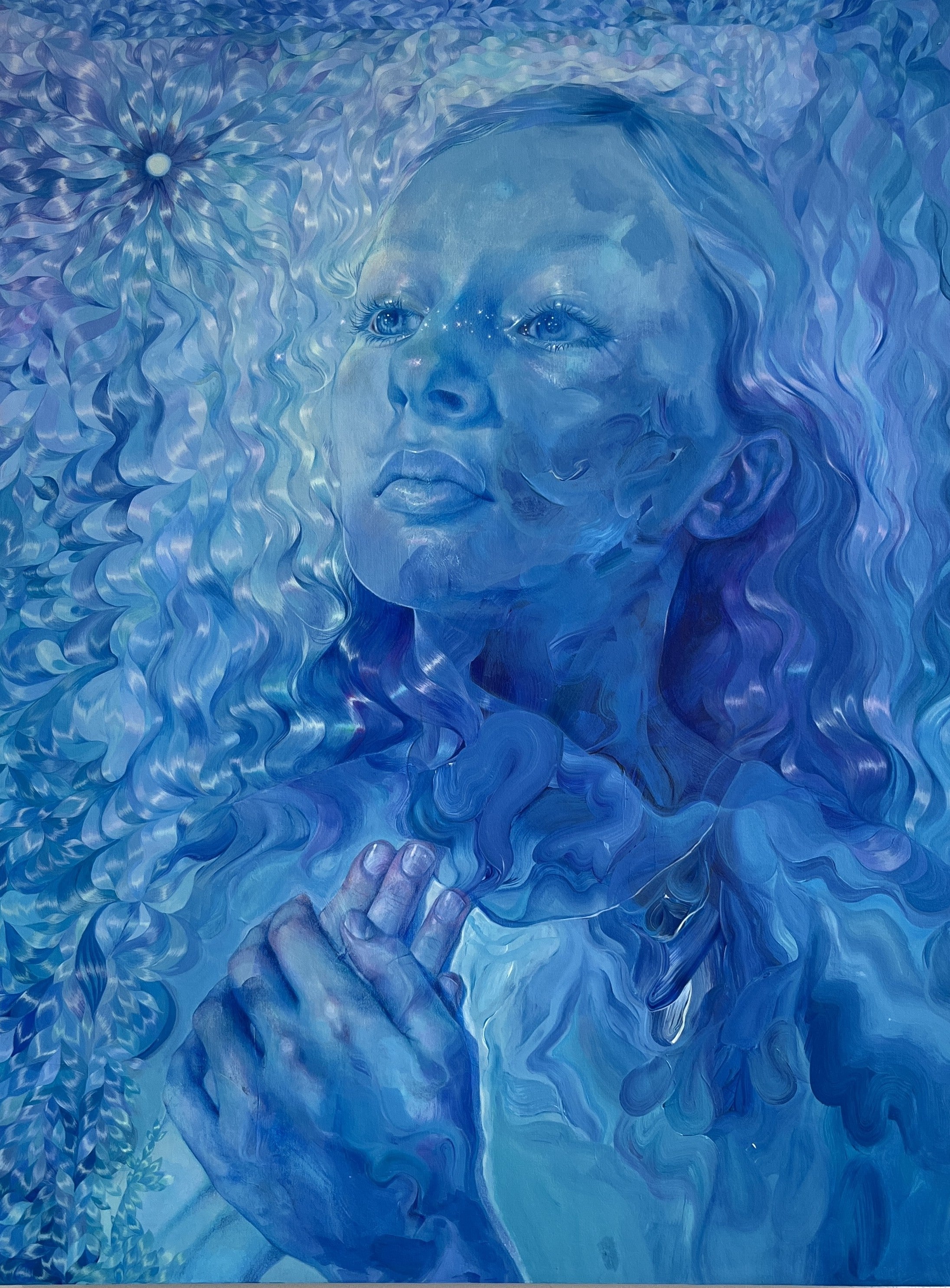 An abstract blue portrait painting of a woman with flowing hair, rendered in shades of blue and purple with a textured, marbled effect.